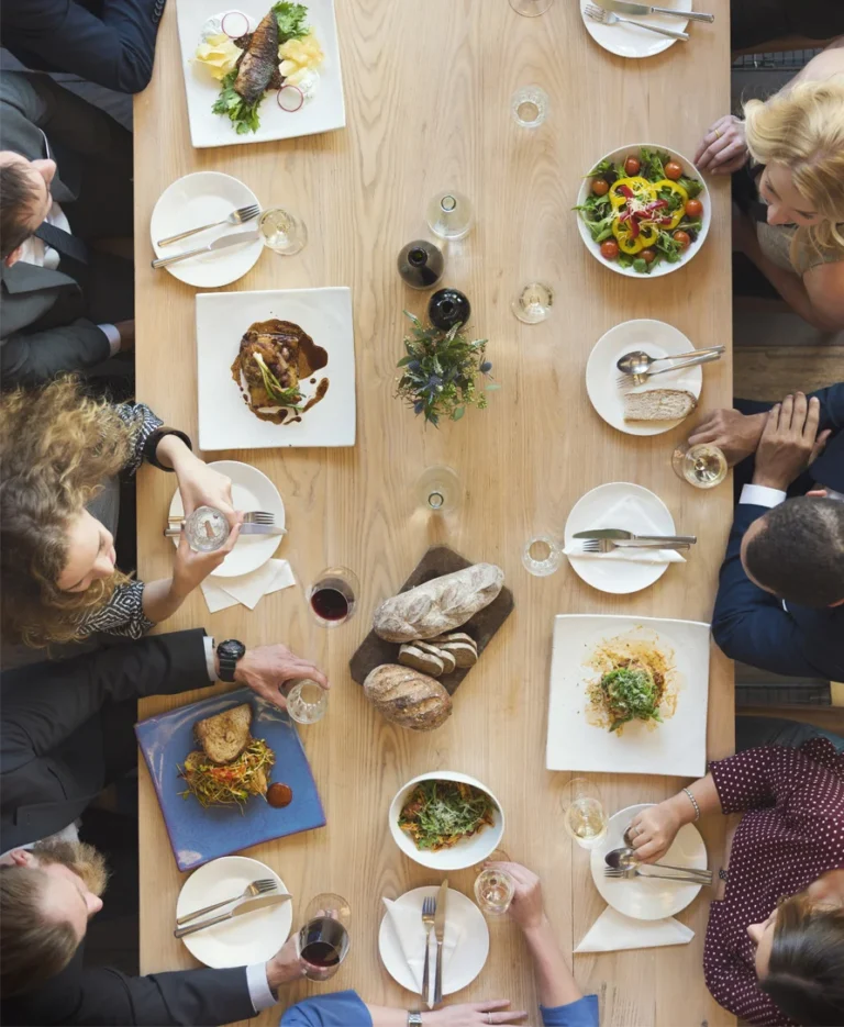 a group of people eating at a table